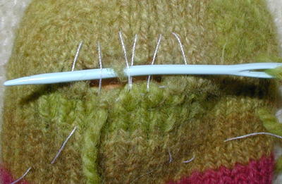 Halfway through the hole, showing the use of the sewing thread framework
