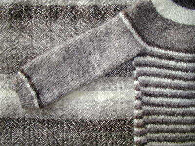 examples of tracking and slanted stitches due to unbalanced yarns